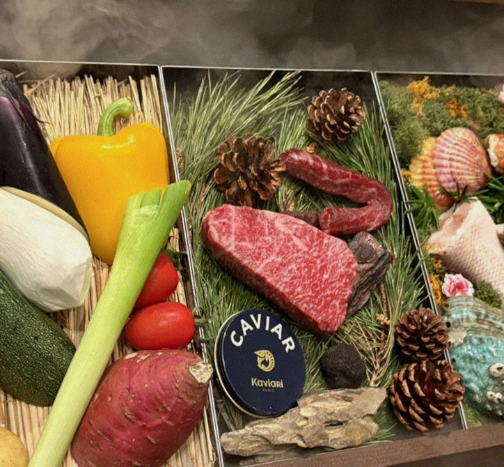 WOOHANA Yeouido · the signature Hanwoo showing — marbled beef cuts and caviar presented in a display chest