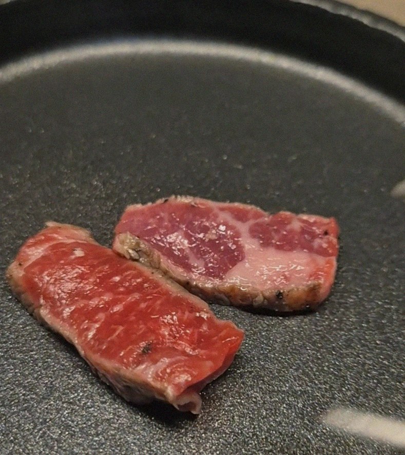 WOOARA Gwanghwamun · premium marbled Hanwoo beef presented before grilling
