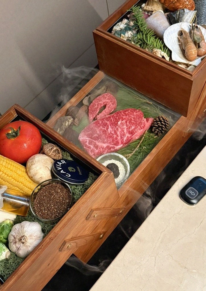 WOOARA Gwanghwamun · the signature Hanwoo showing — marbled beef cuts and caviar presented in a display chest
