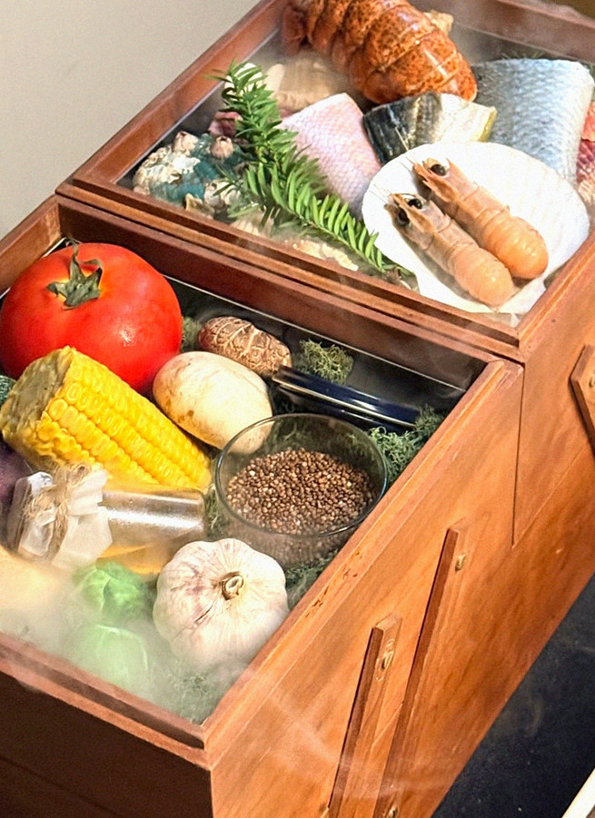 WOOARA Gwanghwamun · the signature Hanwoo showing — marbled beef cuts and caviar presented in a display chest