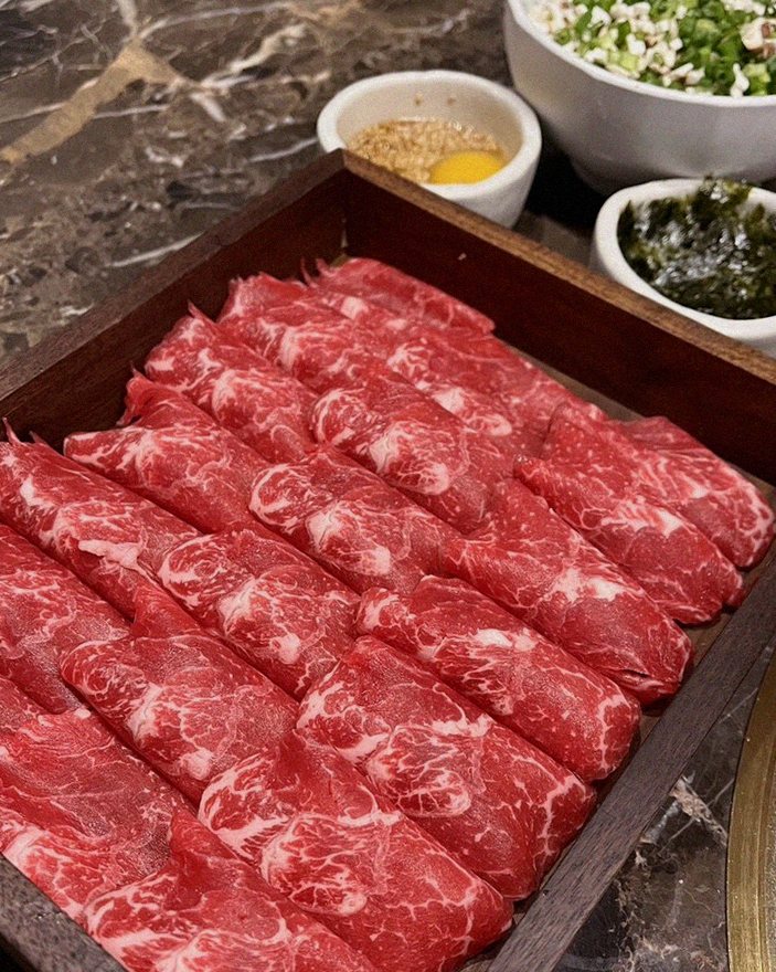 DAEBOJUNG City Hall · premium marbled Hanwoo beef presented before grilling