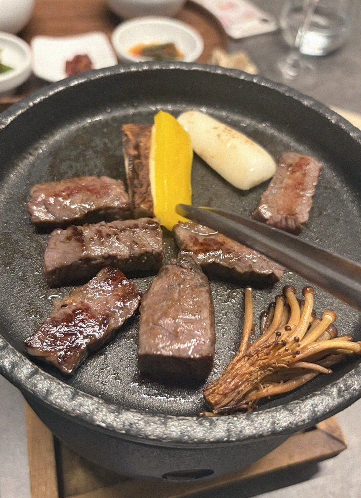 GOWOOGA Yeouido · the signature Hanwoo showing — marbled beef cuts and caviar presented in a display chest