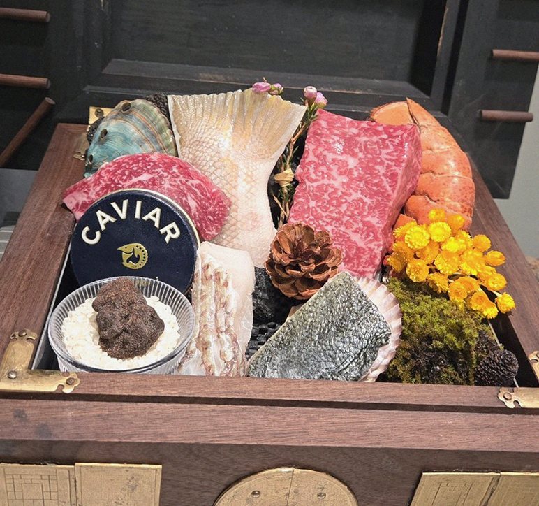 GOWOOGA Gangnam·Yeoksam · the signature Hanwoo showing — marbled beef cuts and caviar presented in a display chest