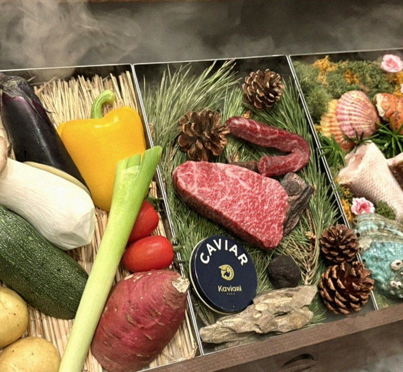 WOOHANA Jonggak · the signature Hanwoo showing — marbled beef cuts and caviar presented in a display chest