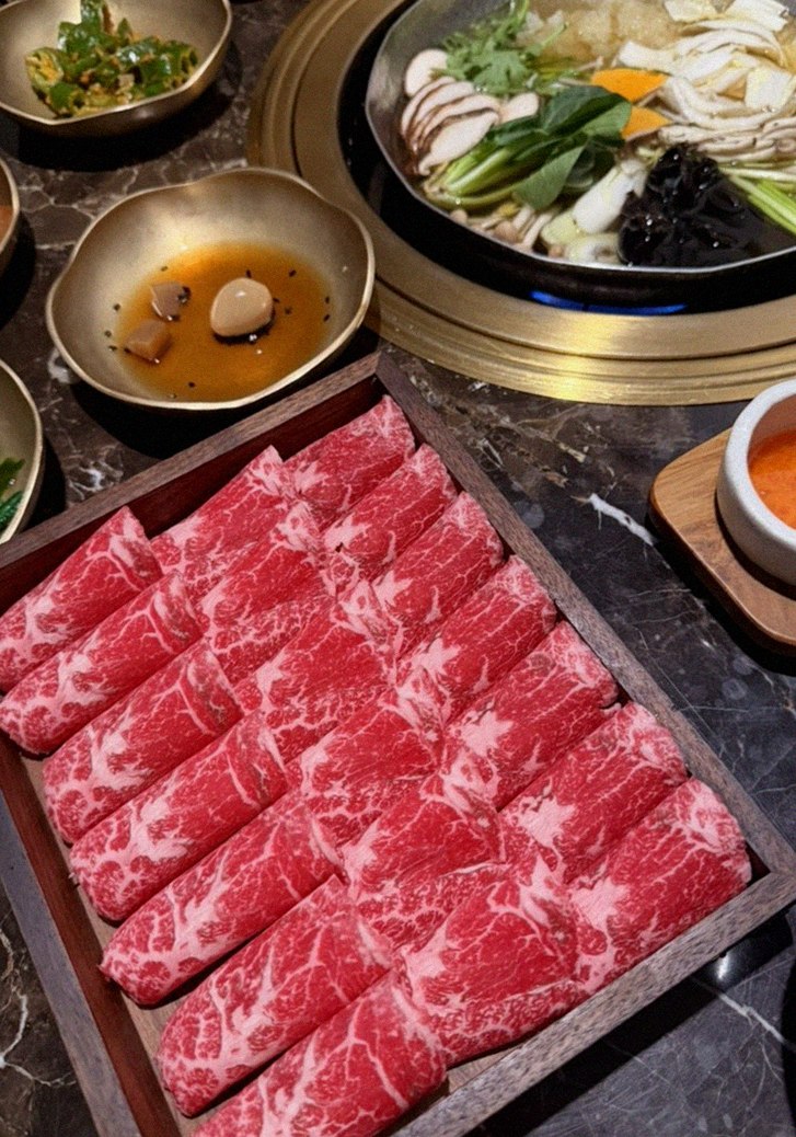DAEBOJUNG City Hall · the signature Hanwoo showing — marbled beef cuts and caviar presented in a display chest