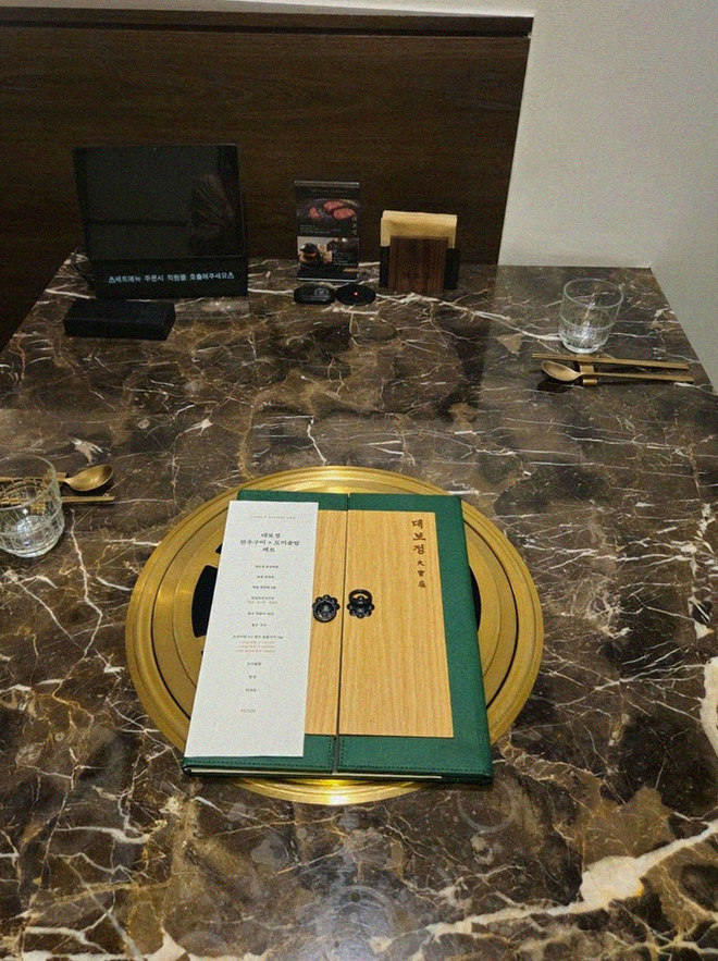 DAEBOJUNG City Hall · the signature Hanwoo showing — marbled beef cuts and caviar presented in a display chest