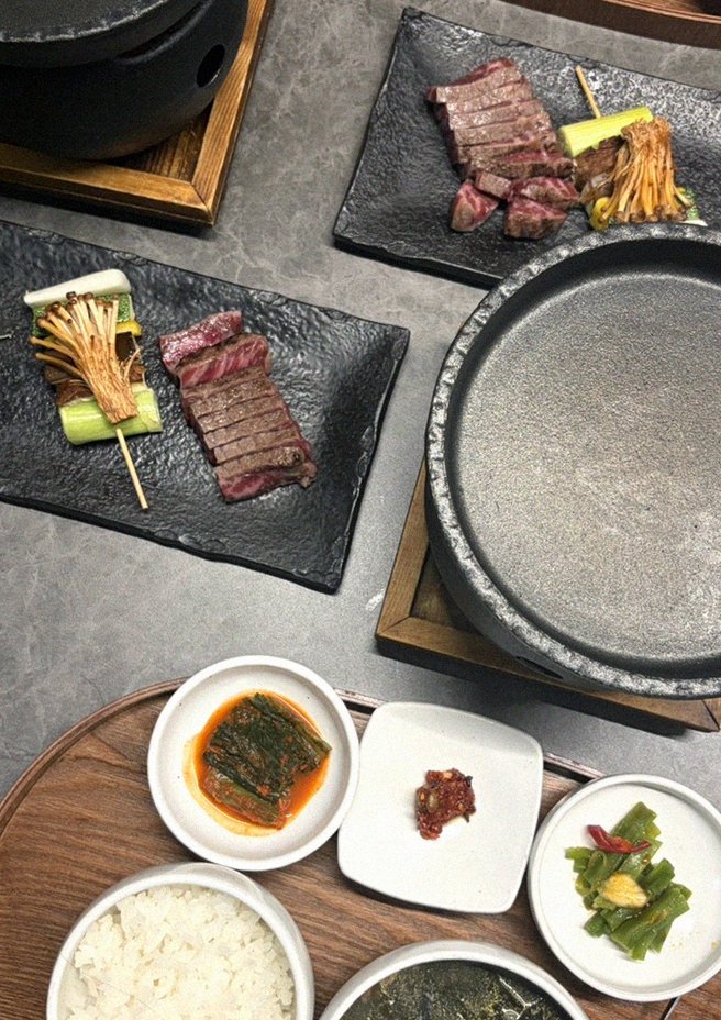 GOWOOGA Yeouido · the signature Hanwoo showing — marbled beef cuts and caviar presented in a display chest