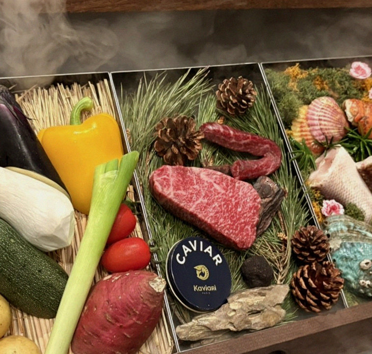WOOHANA Yeouido · the signature Hanwoo showing — marbled beef cuts and caviar presented in a display chest