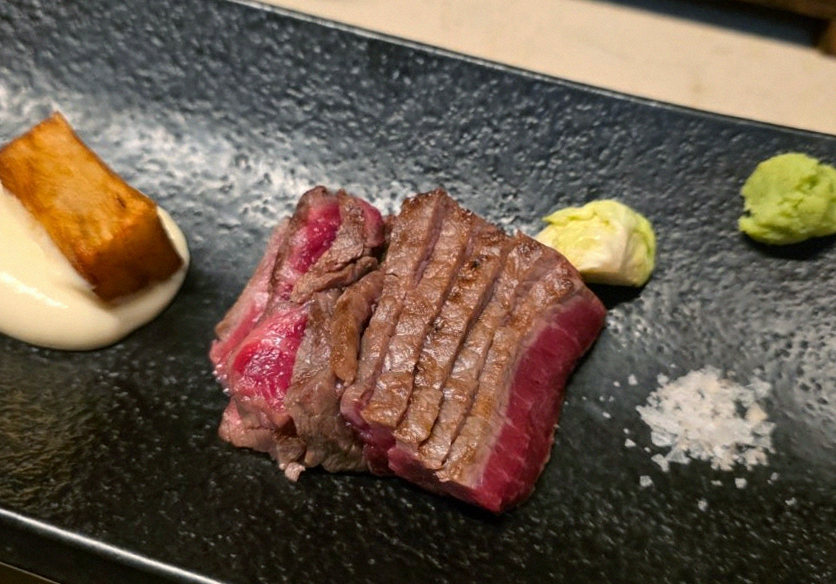 WOOARA Yeouido · the signature Hanwoo showing — marbled beef cuts and caviar presented in a display chest