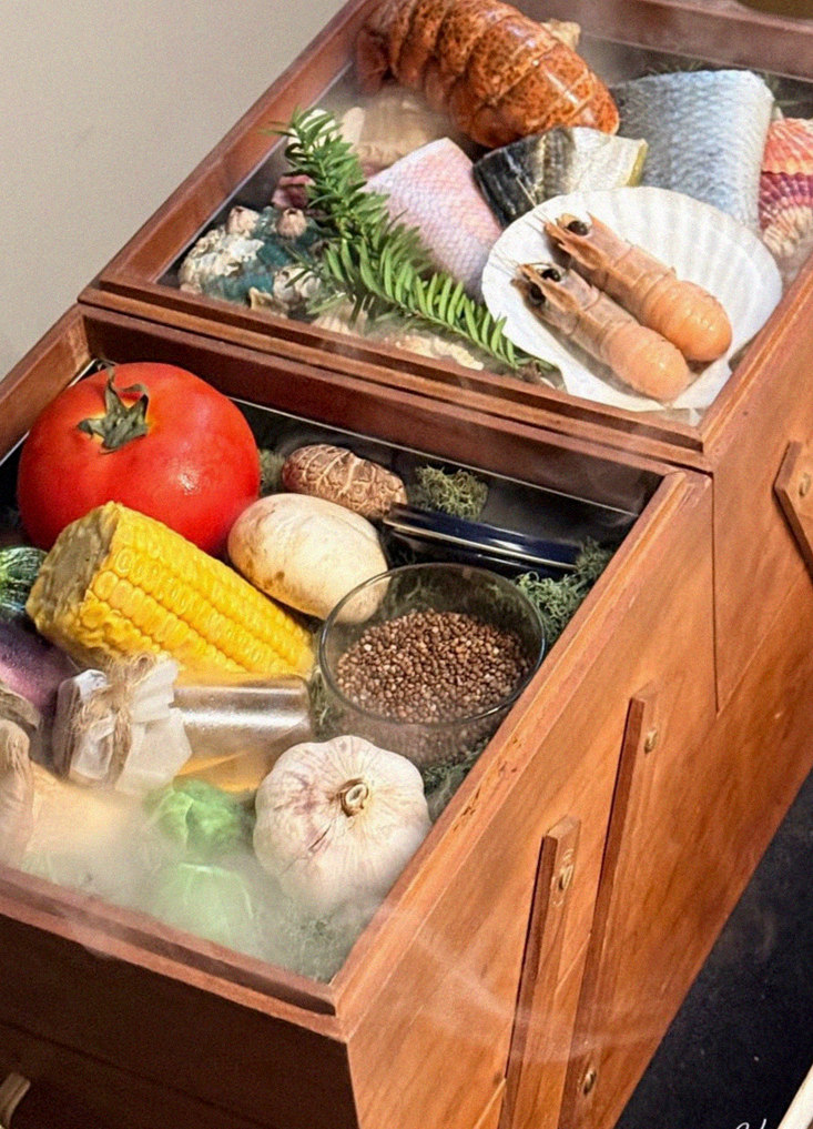 WOOARA Yeouido · the signature Hanwoo showing — marbled beef cuts and caviar presented in a display chest