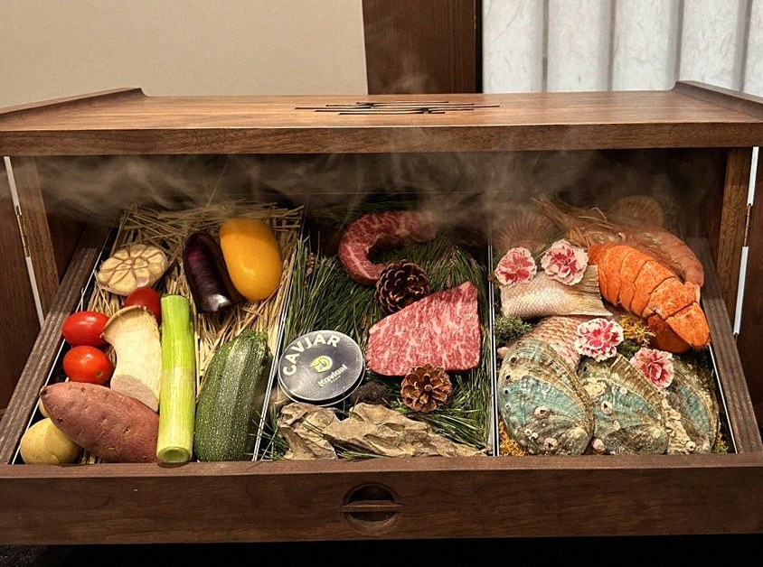 WOOHANA Yeouido · the signature Hanwoo showing — marbled beef cuts and caviar presented in a display chest