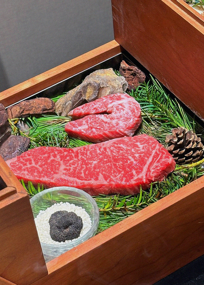 WOOARA Gwanghwamun · the signature Hanwoo showing — marbled beef cuts and caviar presented in a display chest