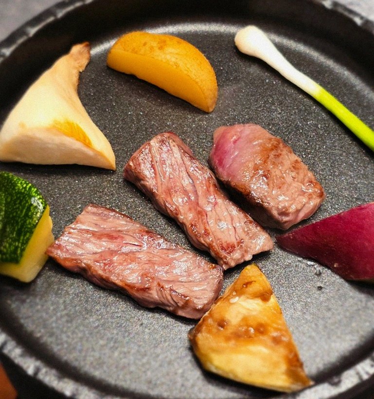 WOOHANA Jonggak · the signature Hanwoo showing — marbled beef cuts and caviar presented in a display chest