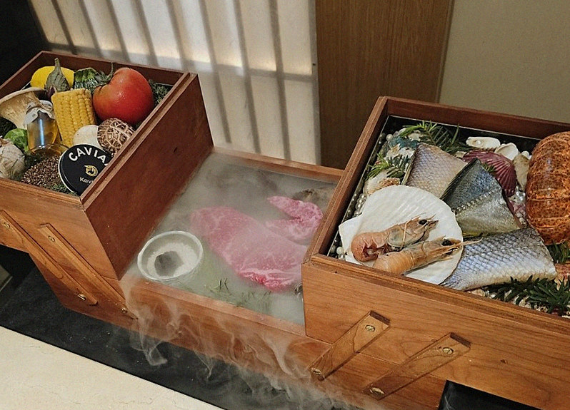 WOOARA Gwanghwamun · the signature Hanwoo showing — marbled beef cuts and caviar presented in a display chest
