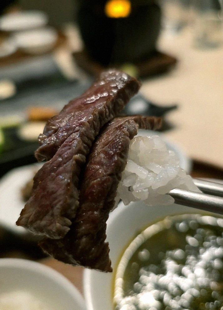 WOOARA Yeouido · the signature Hanwoo showing — marbled beef cuts and caviar presented in a display chest