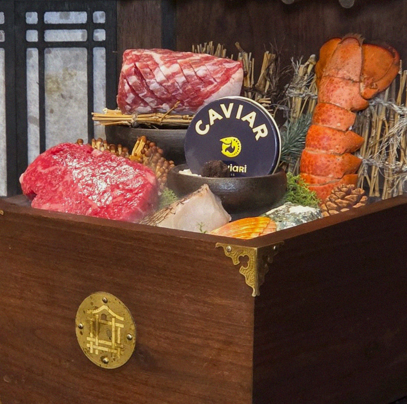 DAEBOJUNG City Hall · the signature Hanwoo showing — marbled beef cuts and caviar presented in a display chest