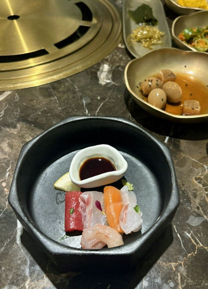 DAEBOJUNG City Hall · the signature Hanwoo showing — marbled beef cuts and caviar presented in a display chest