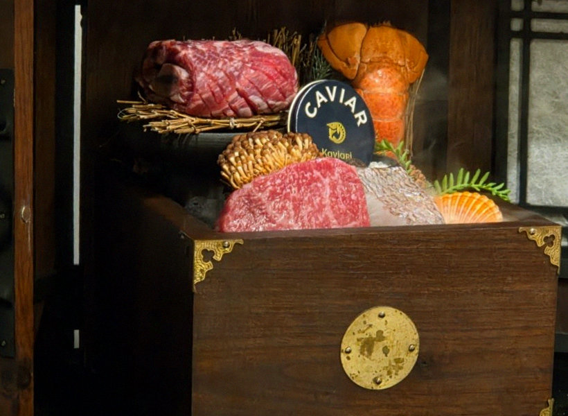 DAEBOJUNG City Hall · the signature Hanwoo showing — marbled beef cuts and caviar presented in a display chest