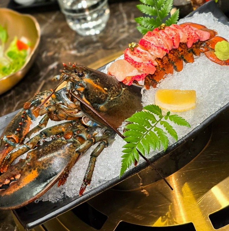 DAEBOJUNG City Hall · the signature Hanwoo showing — marbled beef cuts and caviar presented in a display chest