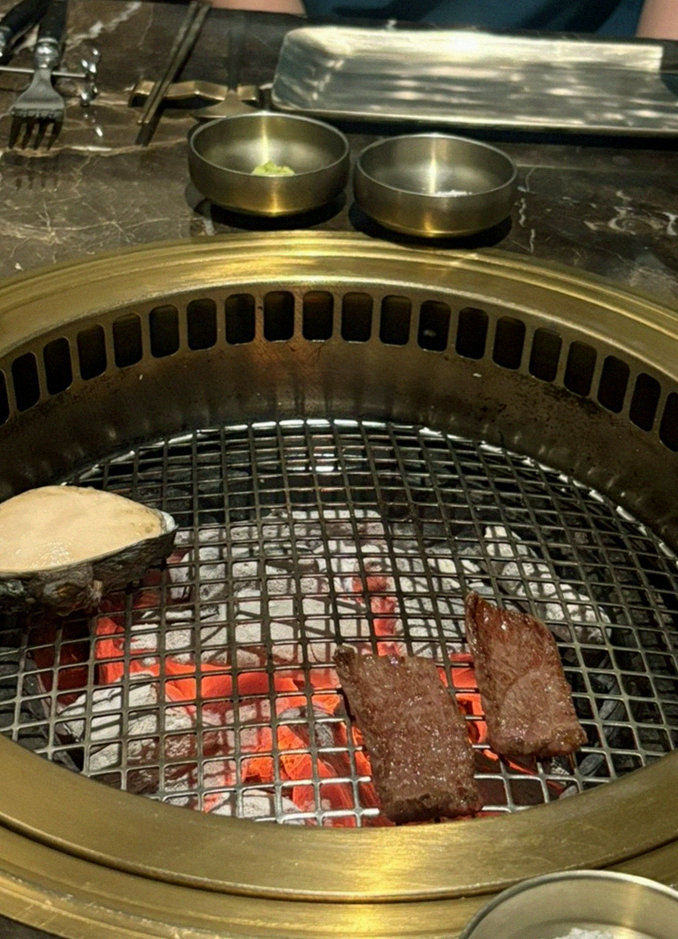 DAEBOJUNG City Hall · the signature Hanwoo showing — marbled beef cuts and caviar presented in a display chest