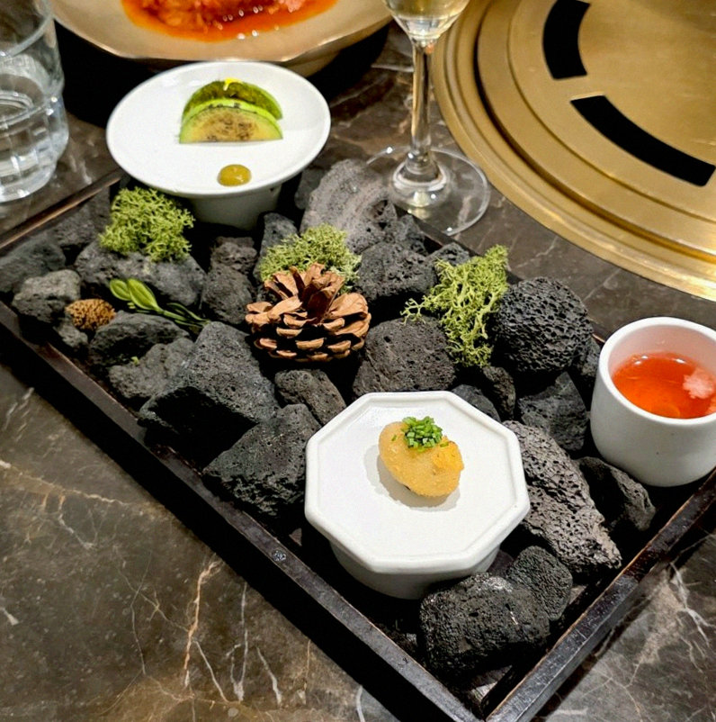 DAEBOJUNG City Hall · the signature Hanwoo showing — marbled beef cuts and caviar presented in a display chest