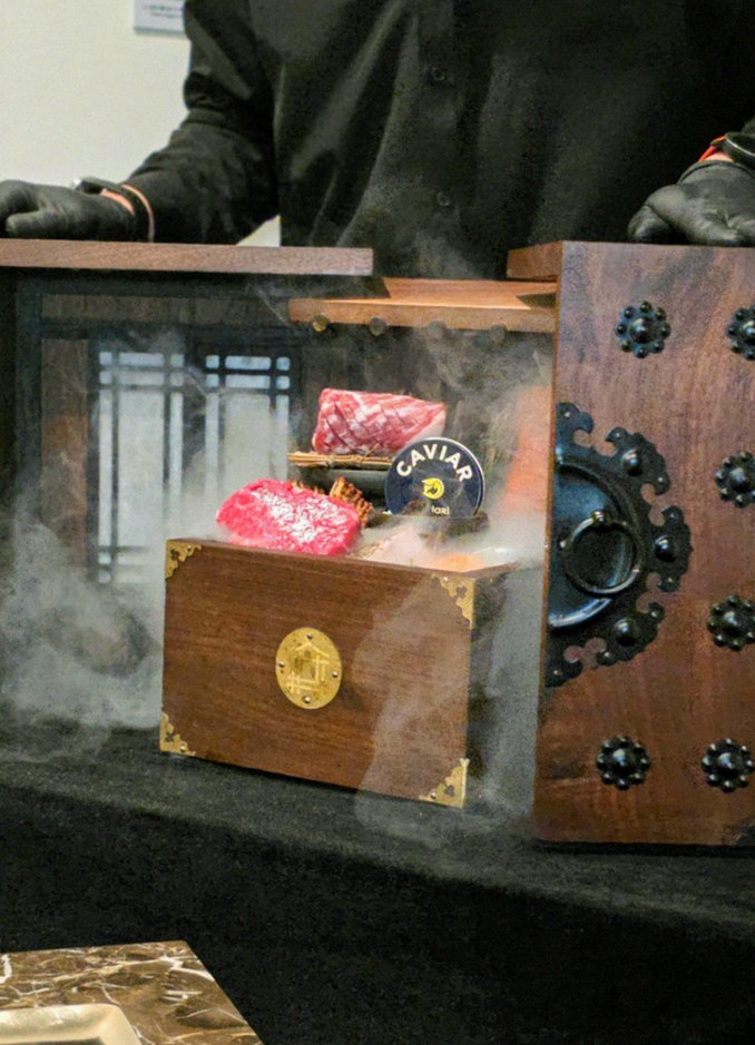 DAEBOJUNG City Hall · the signature Hanwoo showing — marbled beef cuts and caviar presented in a display chest