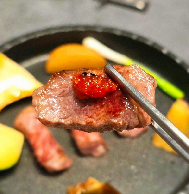 WOOHANA Yeouido · the signature Hanwoo showing — marbled beef cuts and caviar presented in a display chest