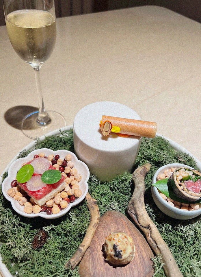 WOOARA Yeouido · the signature Hanwoo showing — marbled beef cuts and caviar presented in a display chest