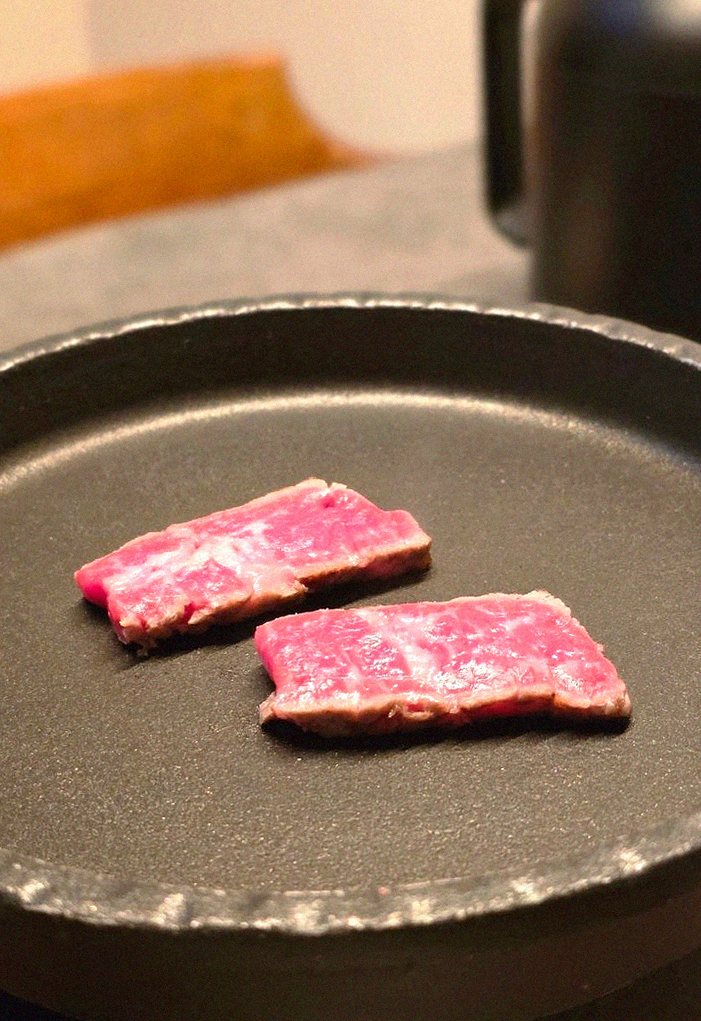 GOWOOGA Yeouido · premium marbled Hanwoo beef presented before grilling