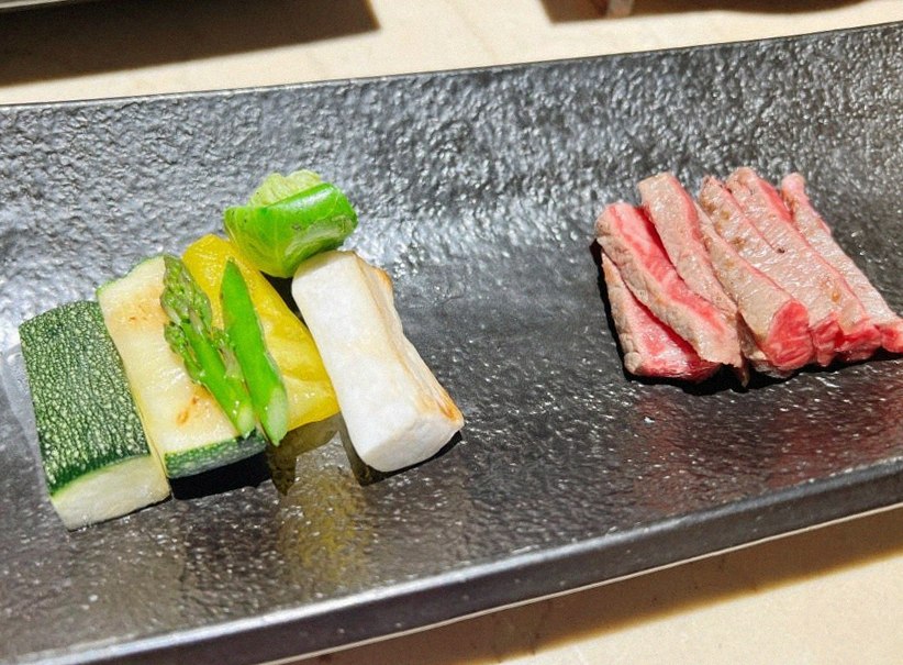 WOOARA Yeouido · the signature Hanwoo showing — marbled beef cuts and caviar presented in a display chest