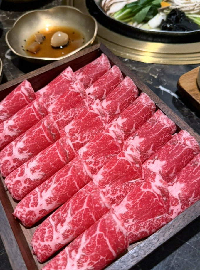 DAEBOJUNG City Hall · premium marbled Hanwoo beef presented before grilling