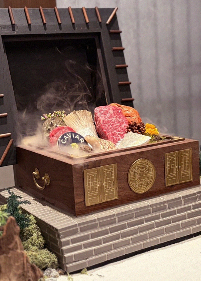 GOWOOGA Gangnam·Yeoksam · the signature Hanwoo showing — marbled beef cuts and caviar presented in a display chest