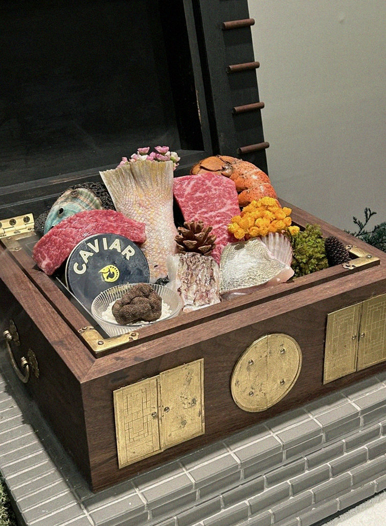 GOWOOGA Yeouido · the signature Hanwoo showing — marbled beef cuts and caviar presented in a display chest