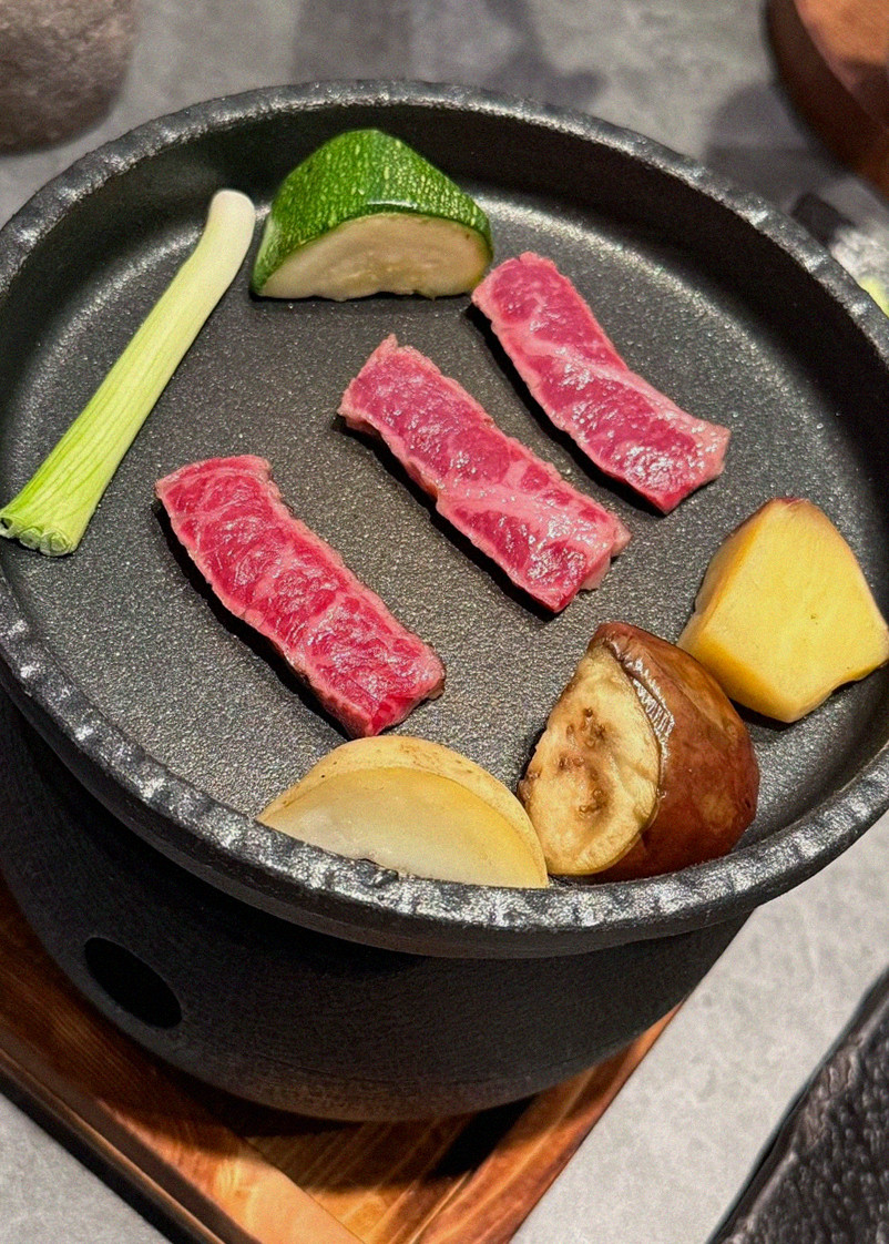 WOOHANA Yeouido · the signature Hanwoo showing — marbled beef cuts and caviar presented in a display chest