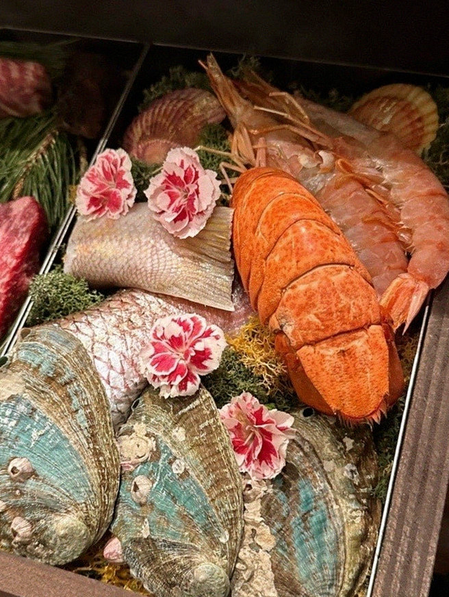 WOOHANA Yeouido · seafood course served alongside the beef