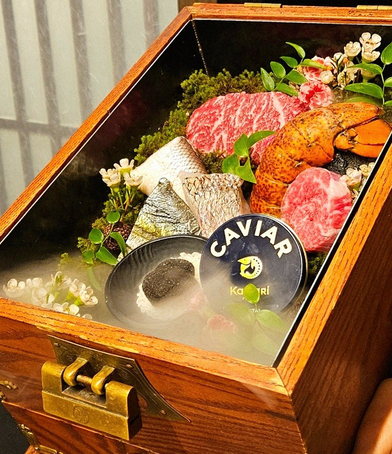 GOWOOGA Yeouido · the signature Hanwoo showing — marbled beef cuts and caviar presented in a display chest