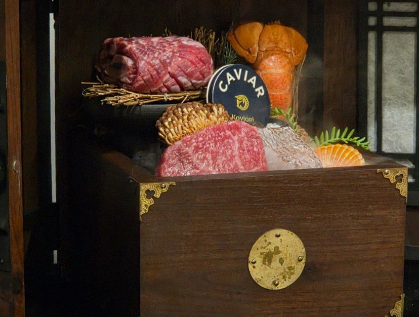 DAEBOJUNG City Hall · the signature Hanwoo showing — marbled beef cuts and caviar presented in a display chest