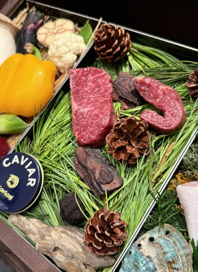 WOOHANA Yeouido · the signature Hanwoo showing — marbled beef cuts and caviar presented in a display chest