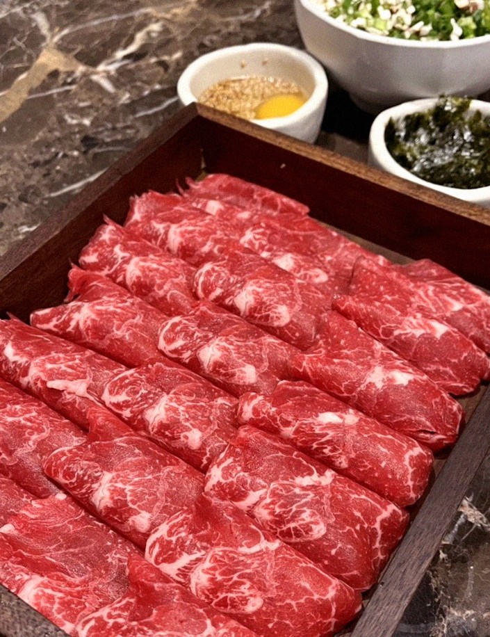 DAEBOJUNG Yeouido · premium marbled Hanwoo beef presented before grilling