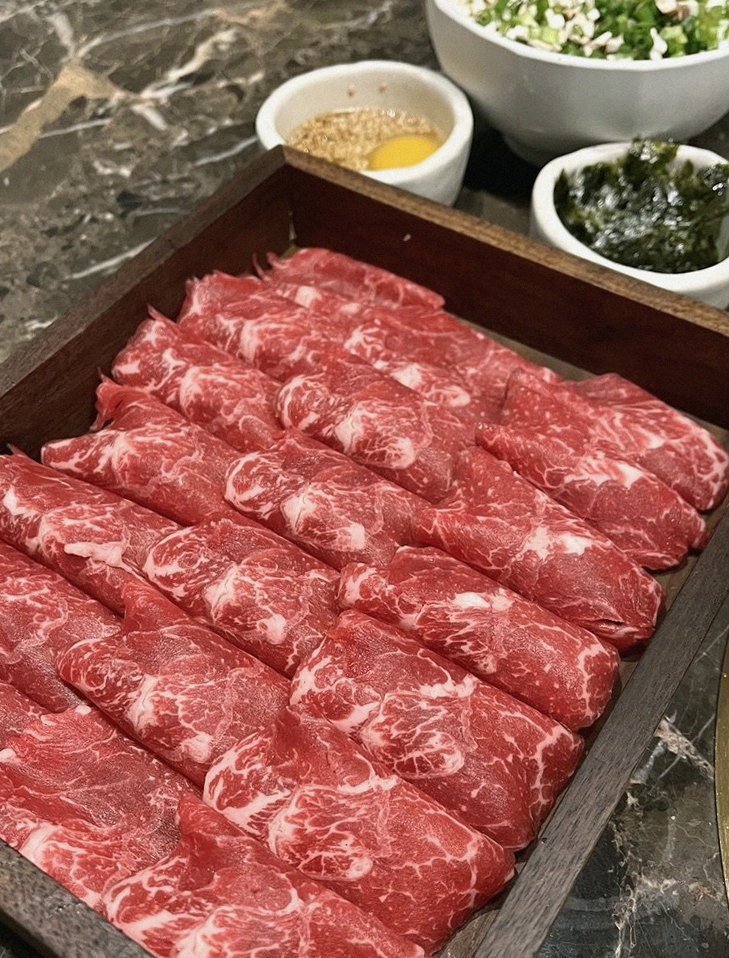 DAEBOJUNG City Hall · premium marbled Hanwoo beef presented before grilling