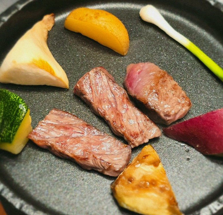 WOOHANA Yeouido · the signature Hanwoo showing — marbled beef cuts and caviar presented in a display chest