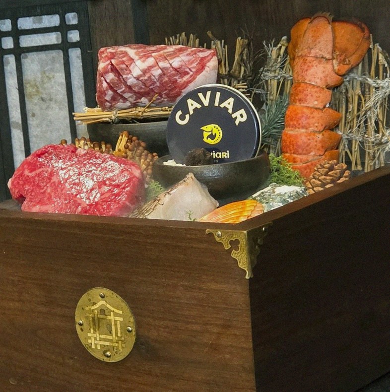 DAEBOJUNG City Hall · the signature Hanwoo showing — marbled beef cuts and caviar presented in a display chest