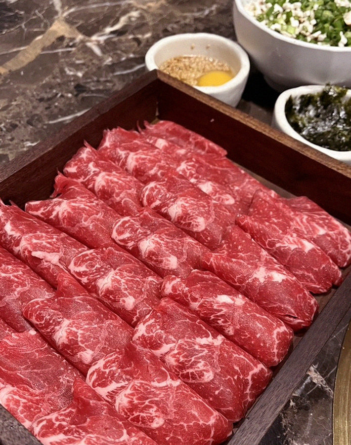 DAEBOJUNG City Hall · premium marbled Hanwoo beef presented before grilling