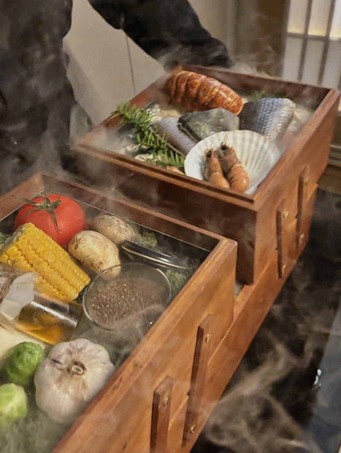 WOOARA Yeouido · the signature Hanwoo showing — marbled beef cuts and caviar presented in a display chest