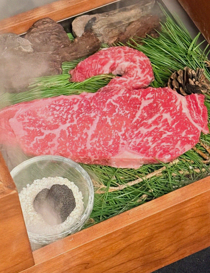 WOOARA Gwanghwamun · the signature Hanwoo showing — marbled beef cuts and caviar presented in a display chest
