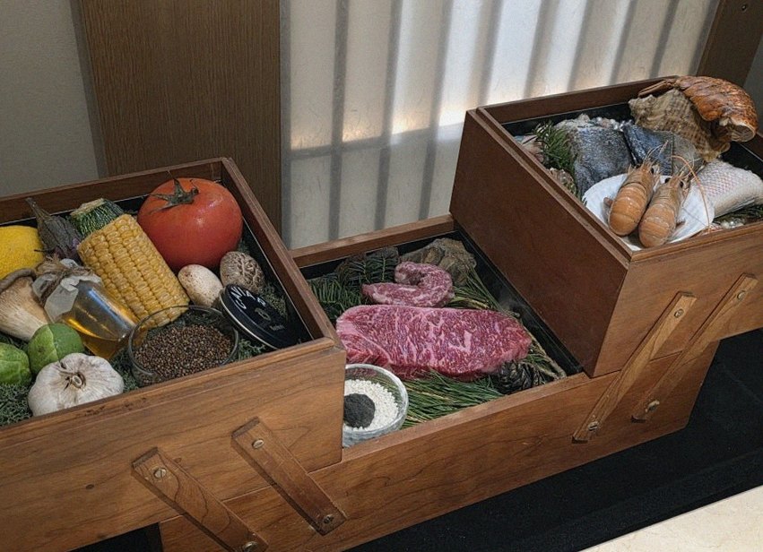 WOOARA Gwanghwamun · the signature Hanwoo showing — marbled beef cuts and caviar presented in a display chest
