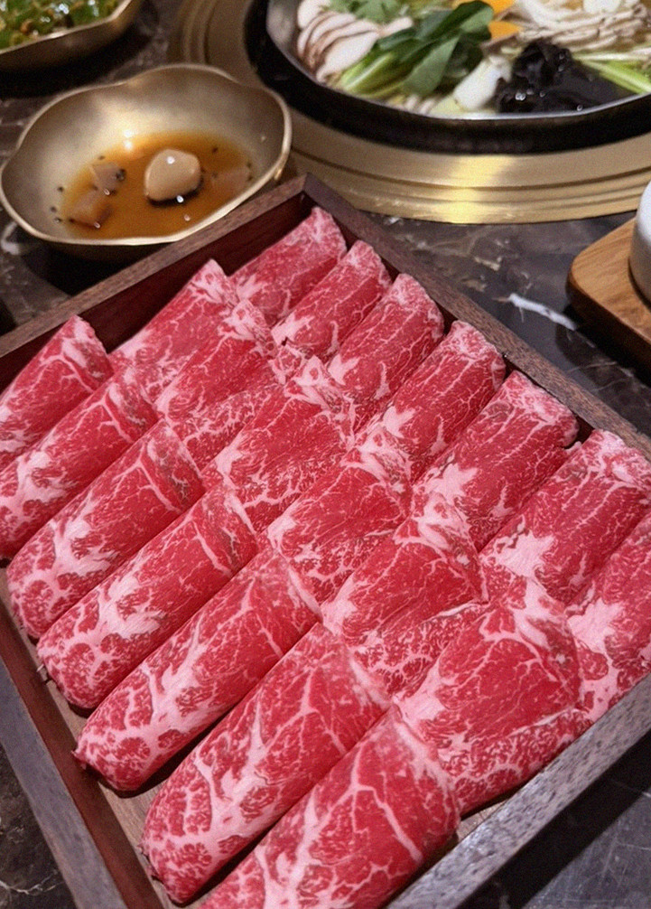 DAEBOJUNG City Hall · premium marbled Hanwoo beef presented before grilling
