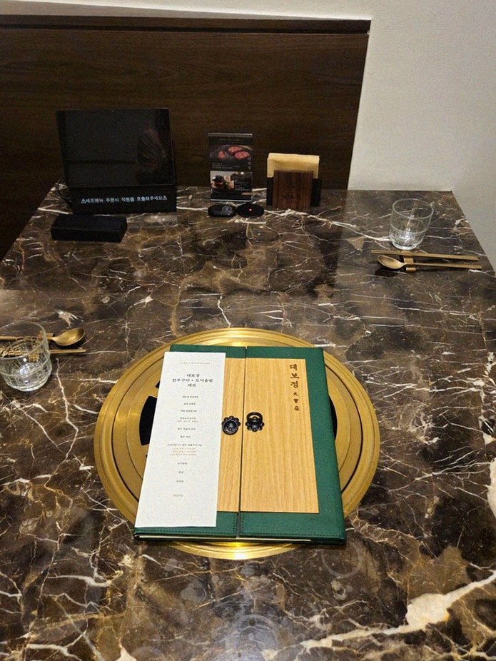 DAEBOJUNG City Hall · the signature Hanwoo showing — marbled beef cuts and caviar presented in a display chest