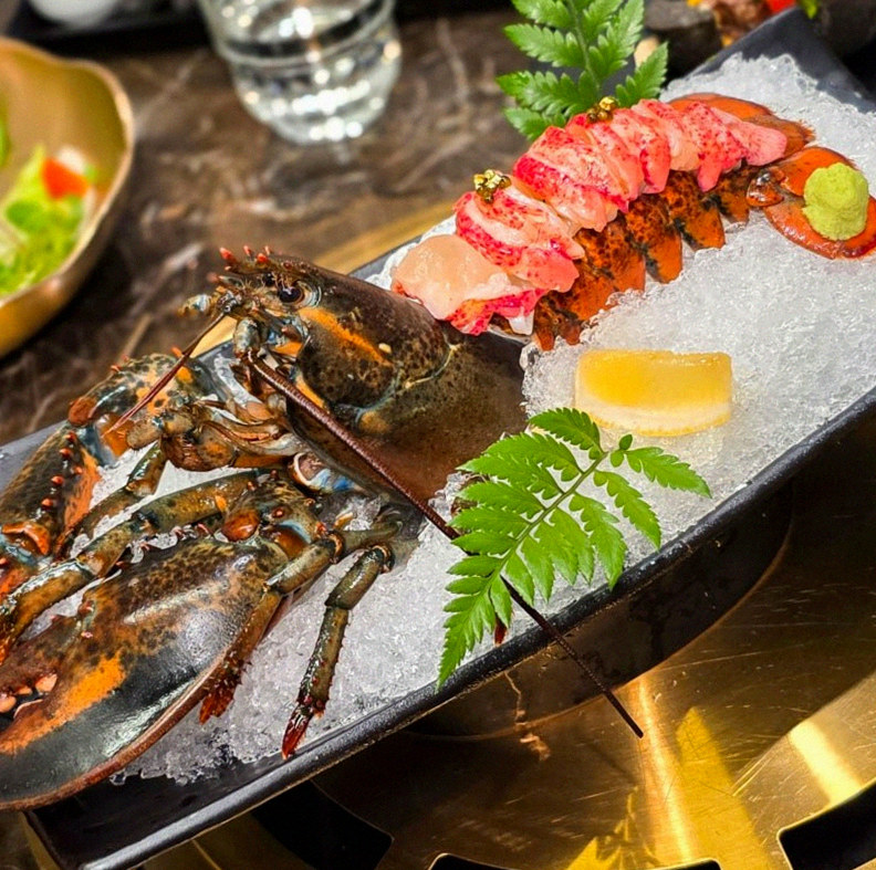 DAEBOJUNG City Hall · the signature Hanwoo showing — marbled beef cuts and caviar presented in a display chest
