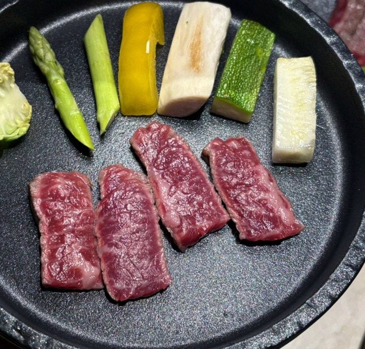 WOOARA Yeouido · premium marbled Hanwoo beef presented before grilling
